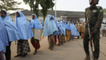 Girls who were kidnapped from a boarding school in the northwest Nigerian state of Zamfara walk in line after their release Afolabi Sotunde/Reuters